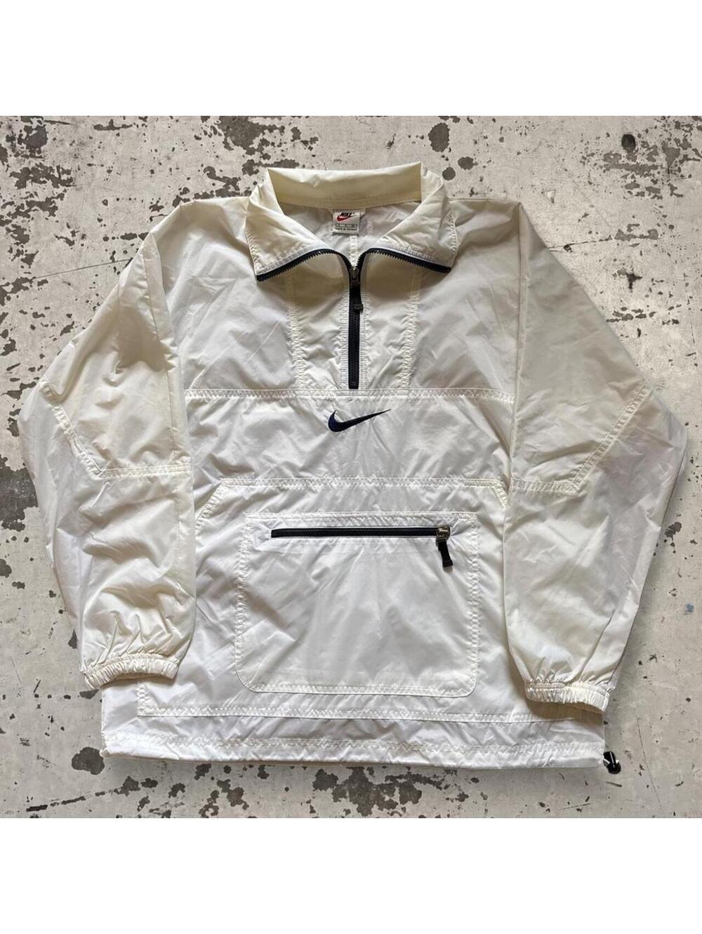 INSANE vintage 1990s center swoosh windbreaker. Fits like L. Has some yellowing